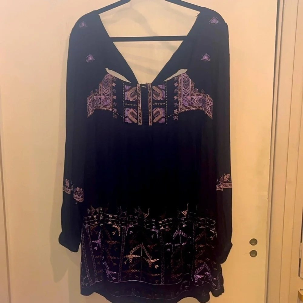 Free People black mini dress size XS with back tie and deep V bk w/ embroidery